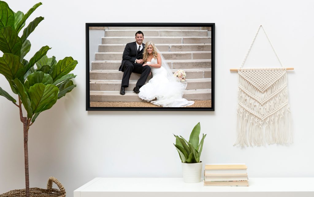 image of a newly wed couple in a frame