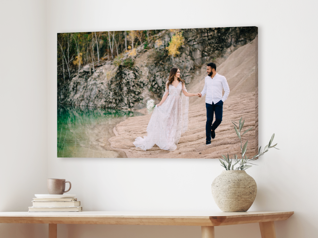 Image of a bride and groom walking on the beach featured on a Gallery Wrap.